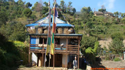 Traditional nepali house with drying food grains